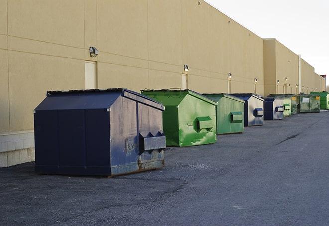 waste collection receptacles placed near a worksite in Beggs